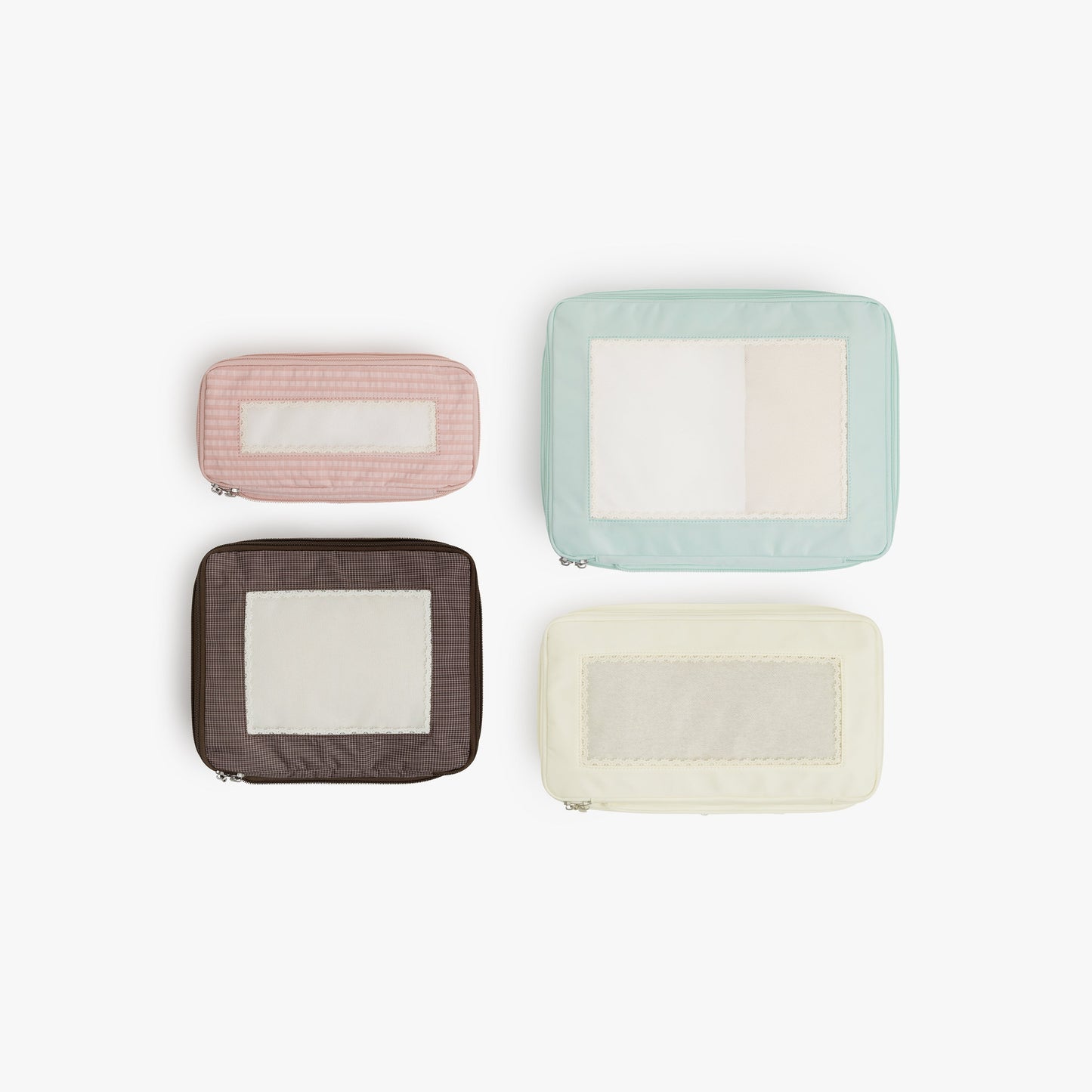 Top view of Monos x Reformation compressible packing cubes arranged flat to show all sizes in Multi colors