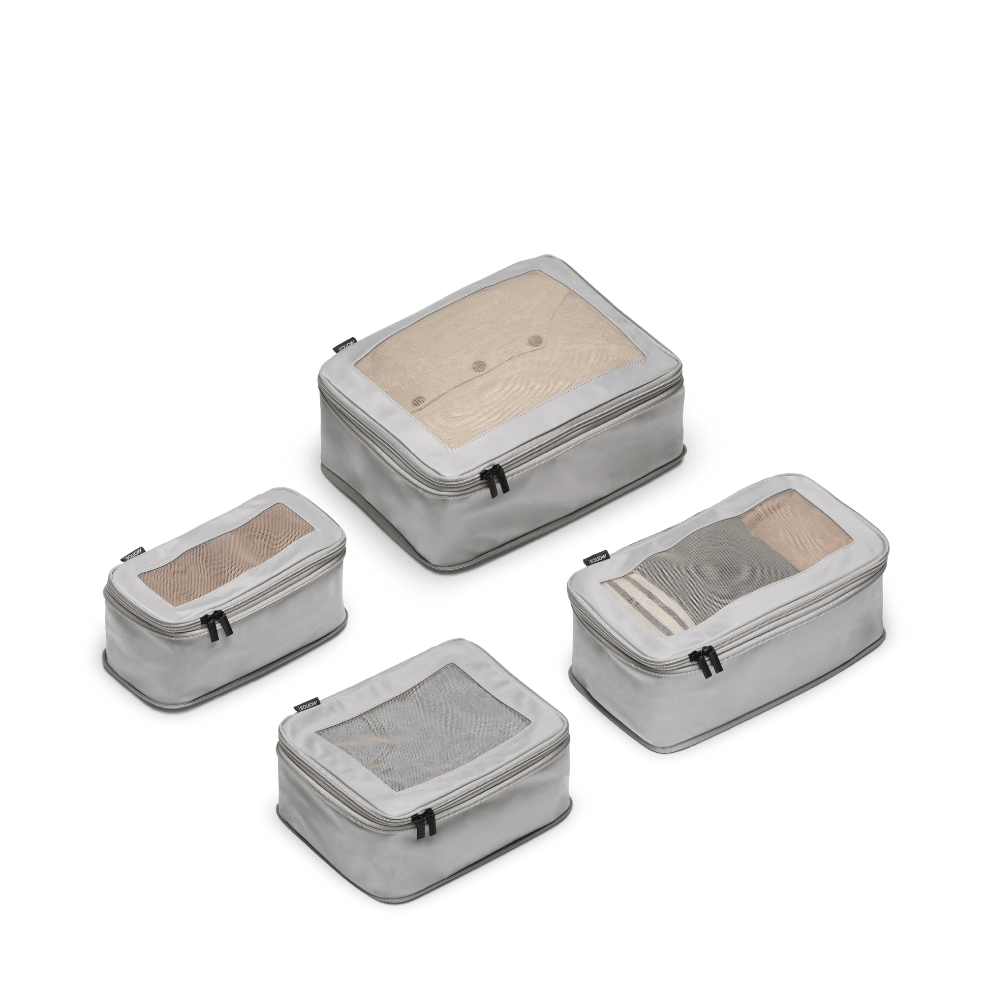 Set of Four / Grey Scaled | This is a photo of a set of four compressible packing cubes in grey