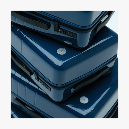 Set of Four / Arles Blue | Stacked Arles Blue suitcases in different sizes