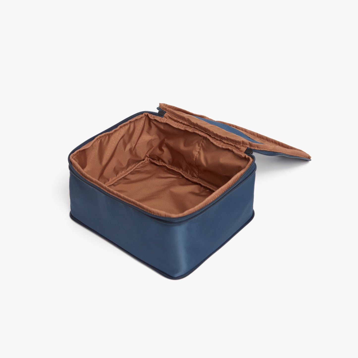 Set of Four / Arles Blue | Photo of an open compressible packing cube with its empty interior visible