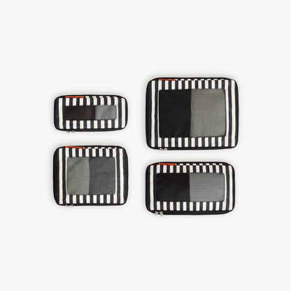 Set of Four / Poplin Stripe Black | Set of four Poplin Stripe Black compressible packing cubes arranged flat to show all sizes