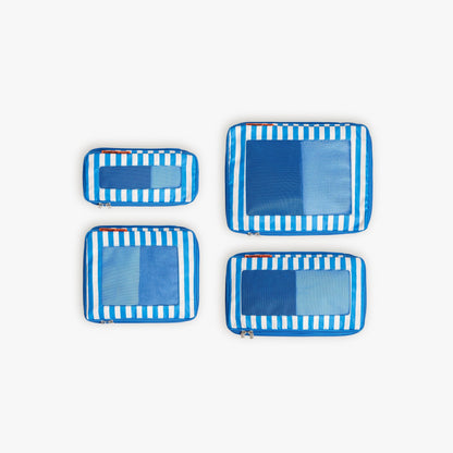 Set of Four / Poplin Stripe Coastal Blue | Set of four Poplin Stripe Coastal Blue compressible packing cubes arranged flat to show all sizes