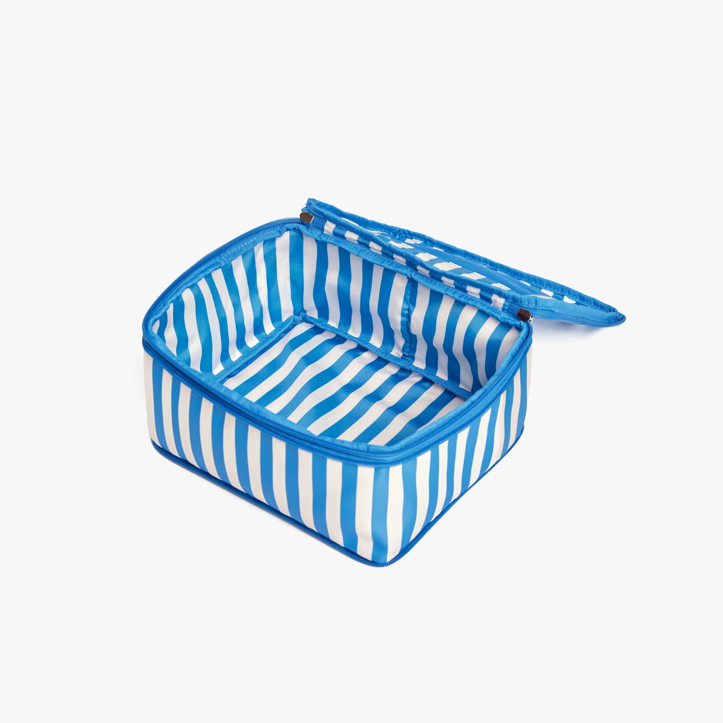 Set of Four / Poplin Stripe Coastal Blue | Open Poplin Stripe Coastal Blue compressible packing cube showing its spacious interior and structured shape